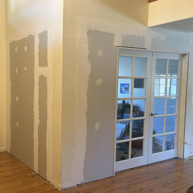two archways that have been framed in and drywalled